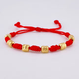 Pulsera Tejida Roja Siete Nudos Cilindros Diamantados Oro Amarillo 18K
