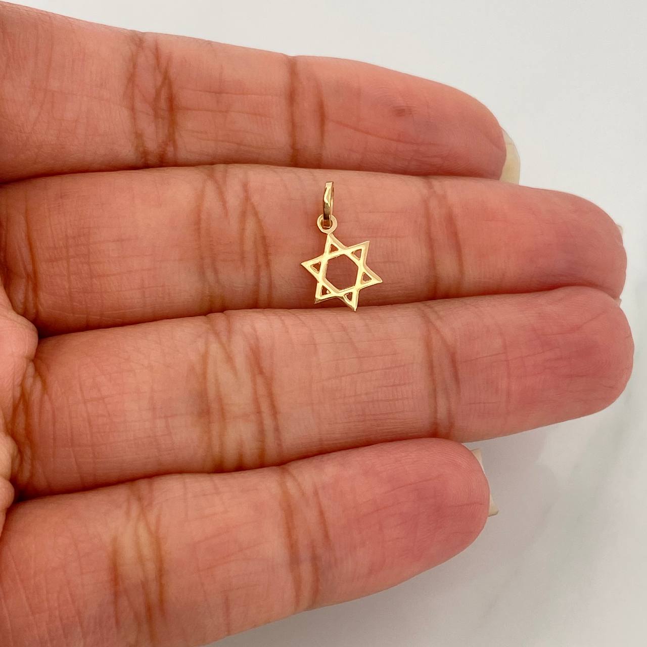 Dije Estrella de David 0.2gr / 1/2 in / Oro Amarillo 18K %