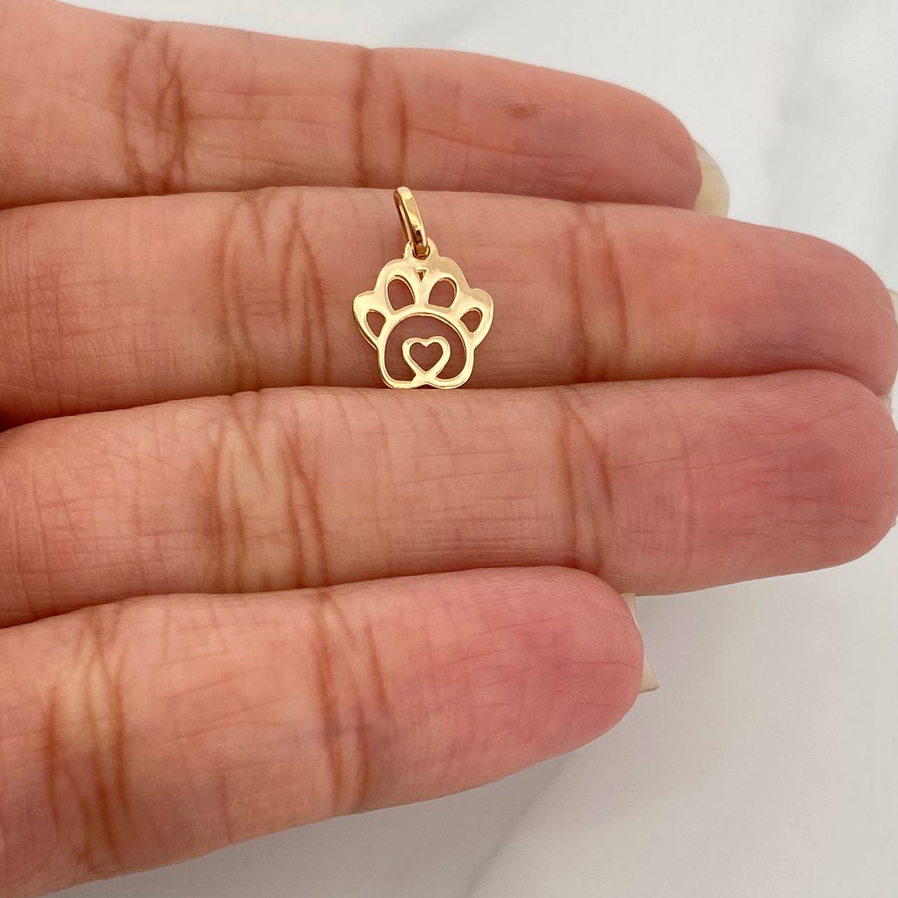 Dije Silueta Huella 0.3gr / 1/2 in / Oro Amarillo 18K %