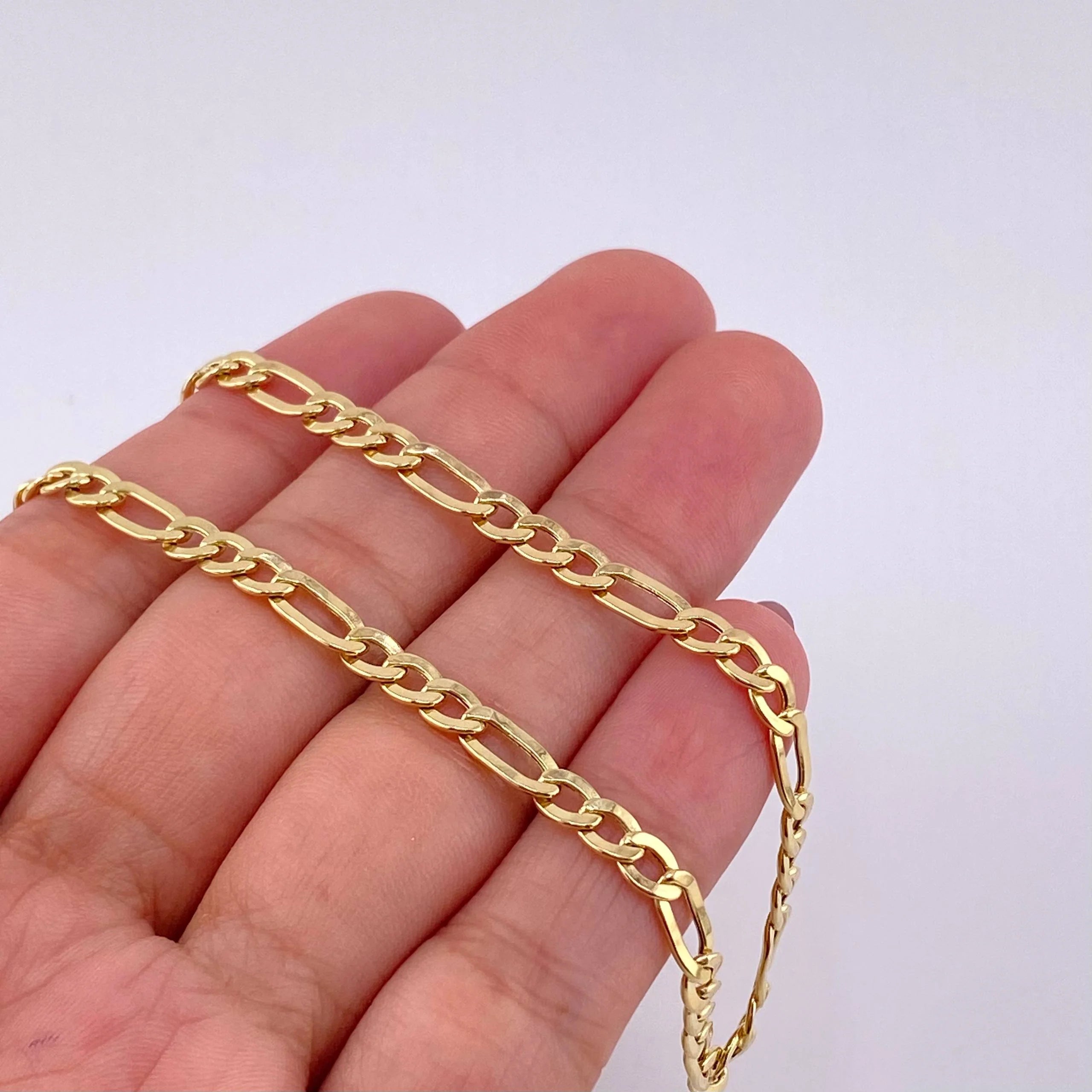 Cadena Figaro 7.3g / 24 in / 2.1mm Oro Amarillo 18K
