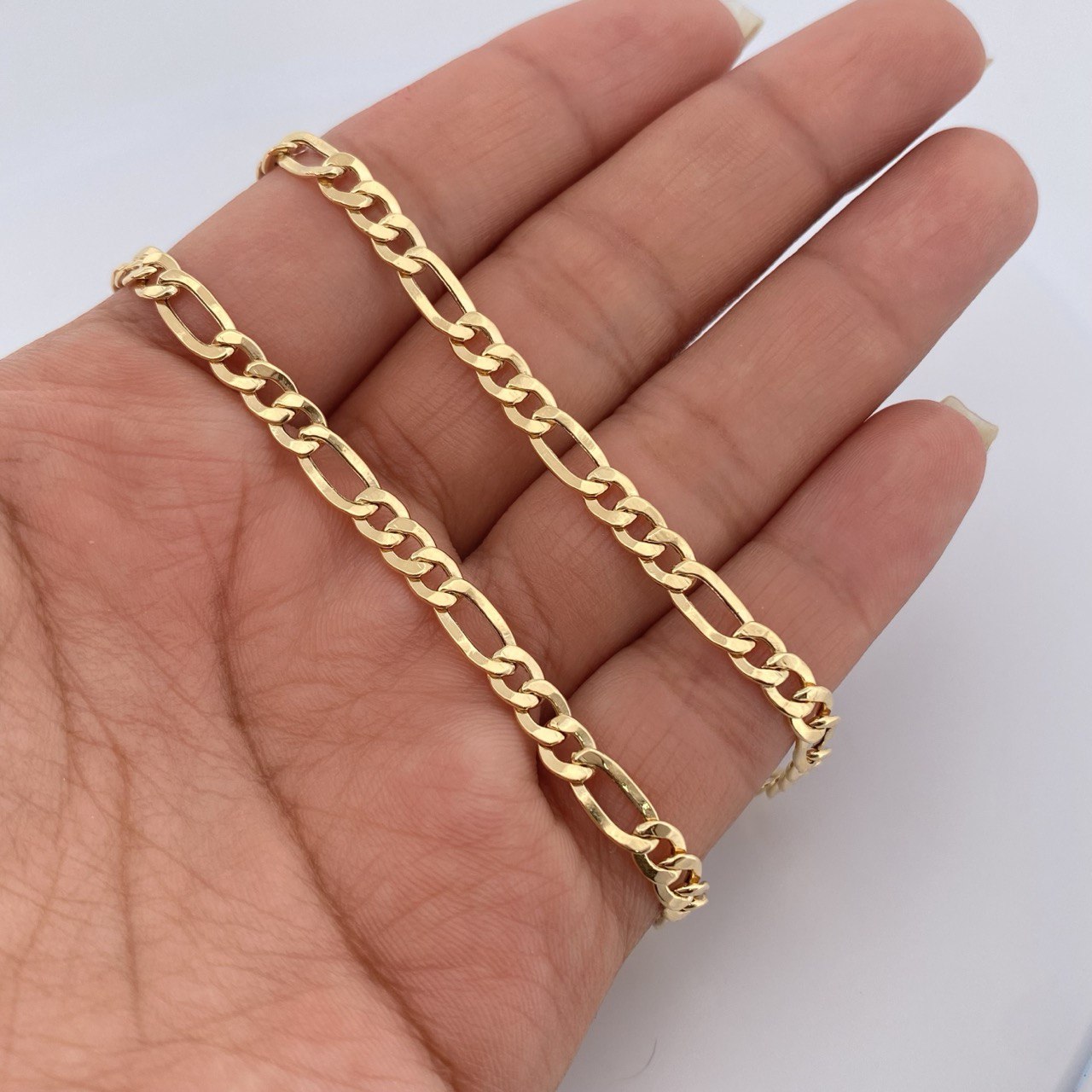 Cadena Figaro 6.1gr / 55cm / +0 Oro 18K &