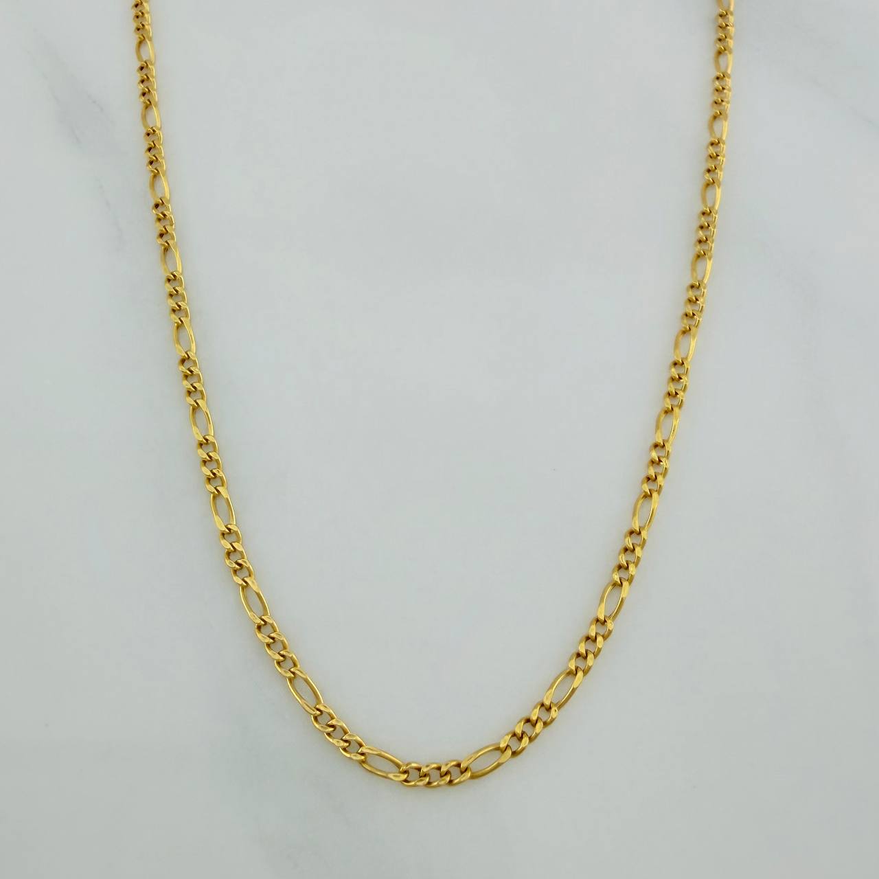 Cadena Figaro 1.35gr / 17 1/2 in / 1.4mm Oro Amarillo +1 18K $