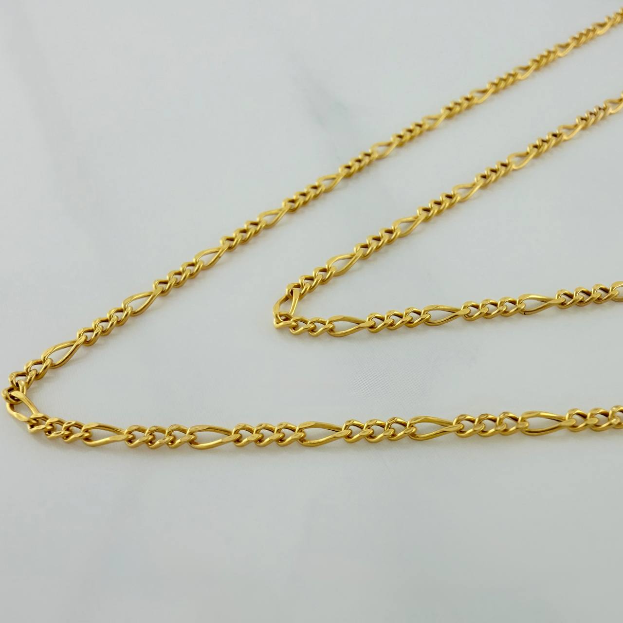 Cadena Figaro 1.35gr / 17 1/2 in / 1.4mm Oro Amarillo +1 18K $