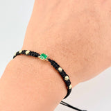 Pulsera Tejida Negra 6 Balines 4mm Cubo Esmeralda 60pts Oro Amarillo 18K