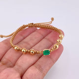 Pulsera Tejida Café 6 Balines 5mm Cubo Esmeralda 60pts Oro Amarillo 18K