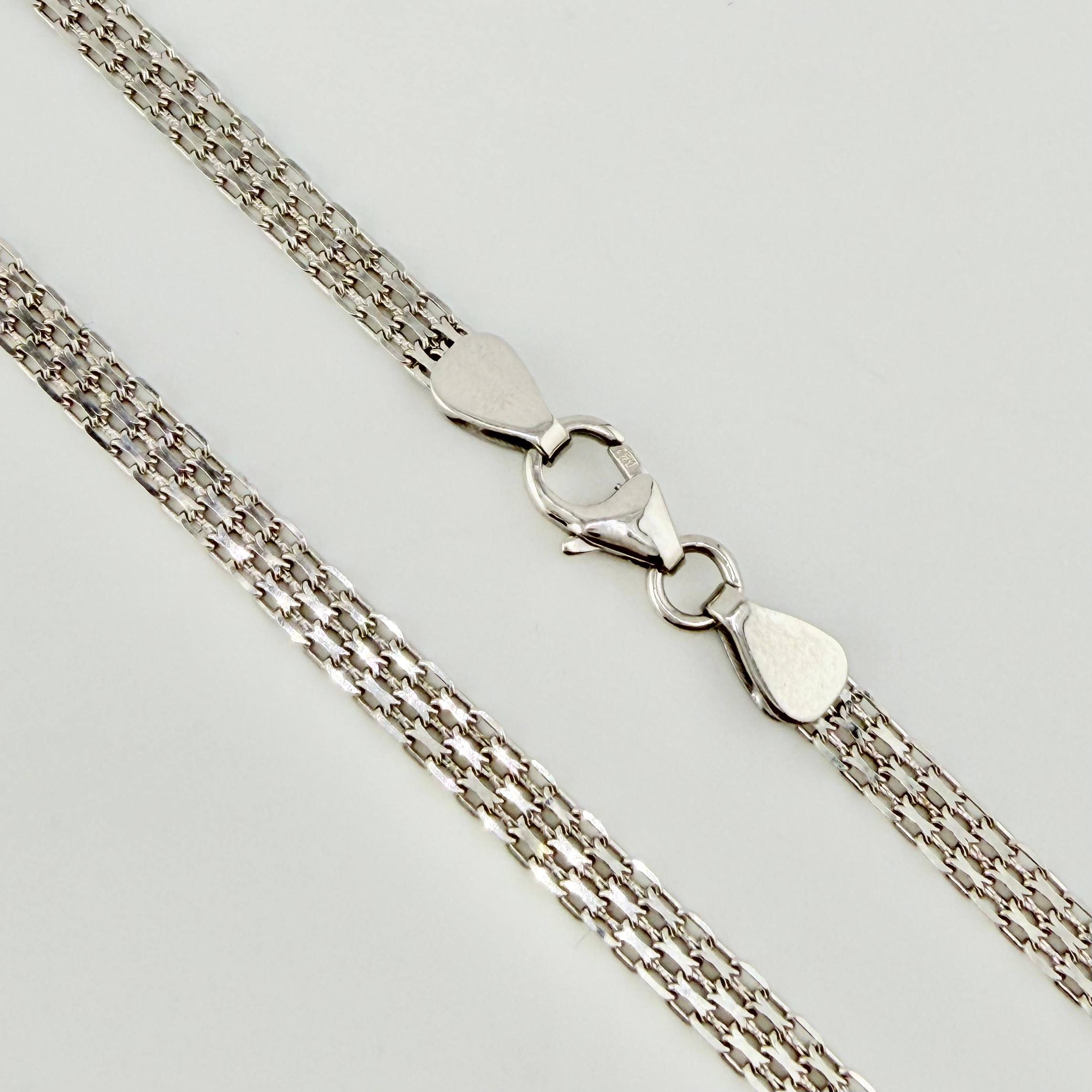 Cadena China 9.1gr / 23 1/2 in / 3.3mm Oro Blanco +1 18K ©