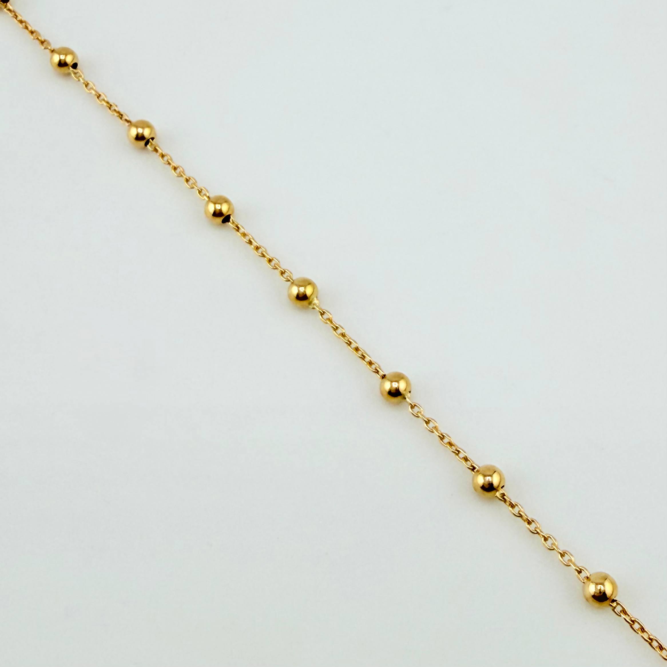 Tobillera Aro Seguido Dije Estrella 2.45gr / 9 3/4 in / 2.3mm Dos Oros Amarillo Blanco +4 18K