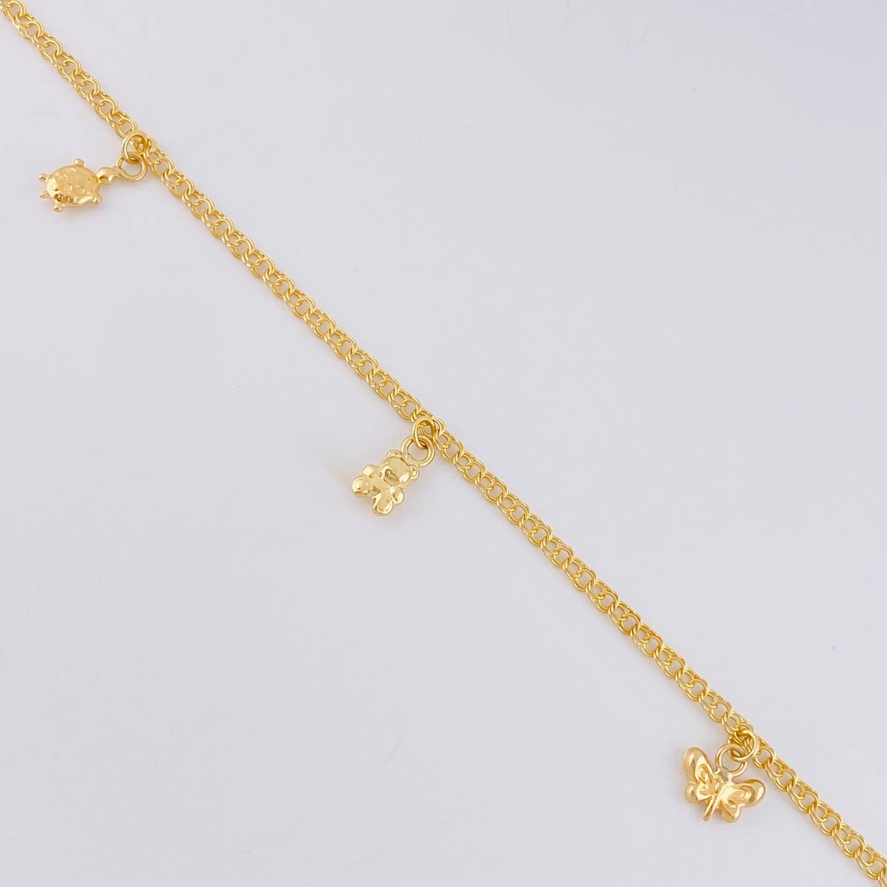 Tobillera Roll On Dijes 3.6 g / 9 3/4 in / 2.3 mm Oro Amarillo 18K