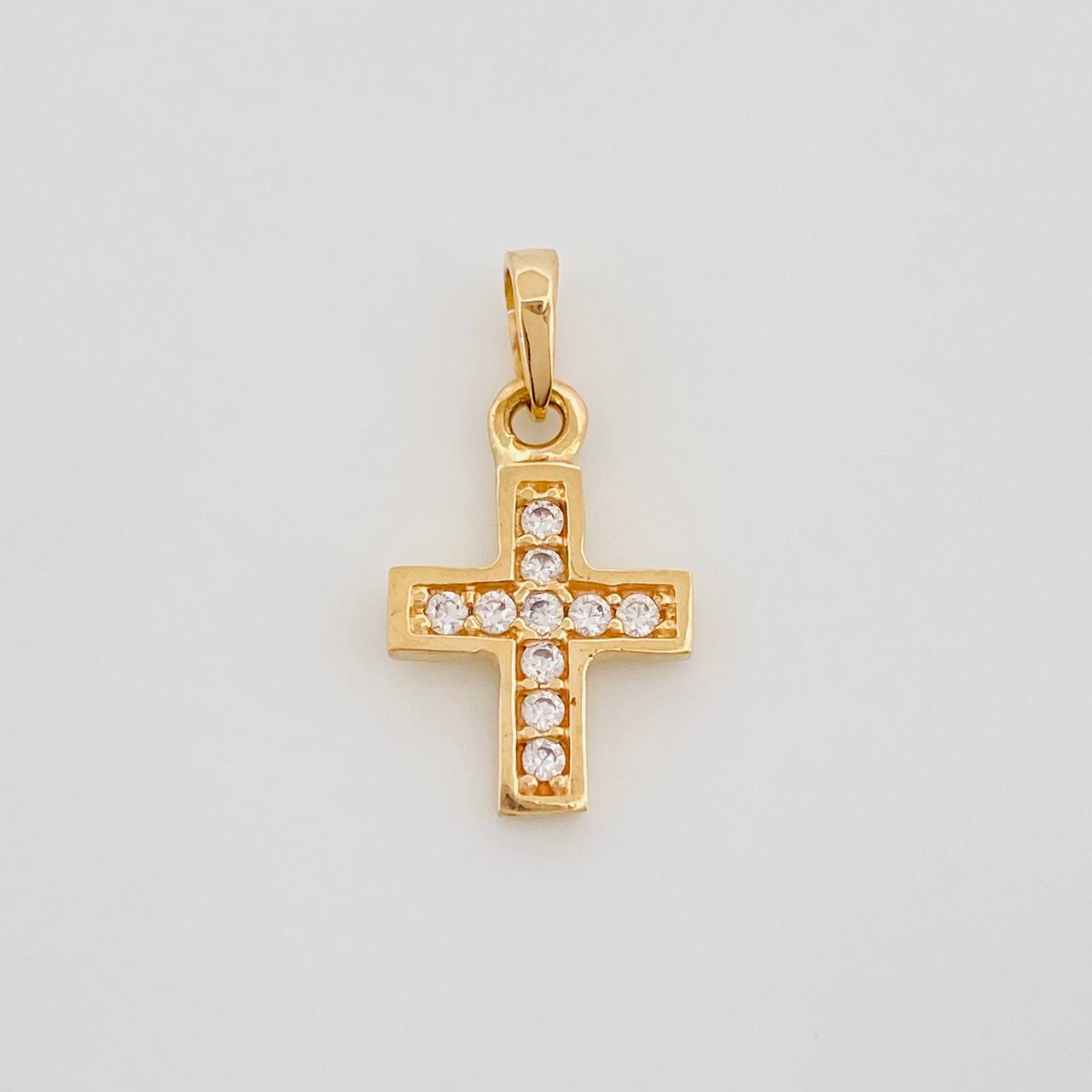 Dije Cruz 0.7 g / 1/2 in Oro Amarillo 18K