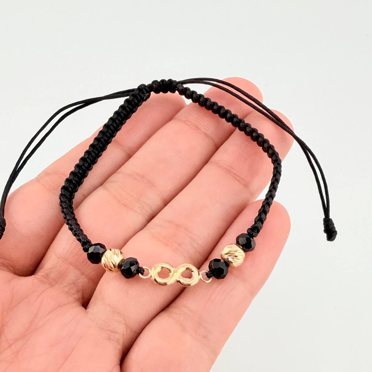 Pulsera Tejida Negra Herraje Infinito Bolas Diamantadas 5Mm / 2 Und Oro Amarillo 18K