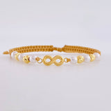 Pulsera Tejida Cafe Herraje Infinito Bolas Diamantadas 4Mm / 4 Und Oro Amarillo 18K