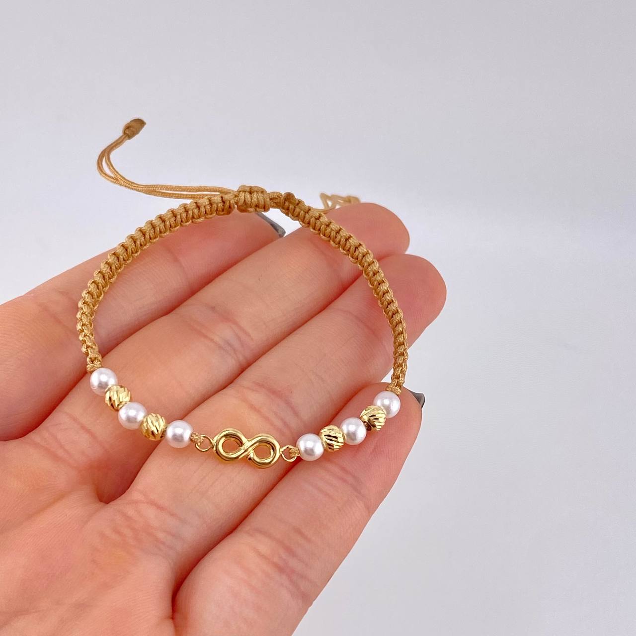 Pulsera Tejida Cafe Herraje Infinito Bolas Diamantadas 4Mm / 4 Und Oro Amarillo 18K
