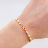 Pulsera Tejida Cafe Herraje Infinito Bolas Diamantadas 4Mm / 4 Und Oro Amarillo 18K