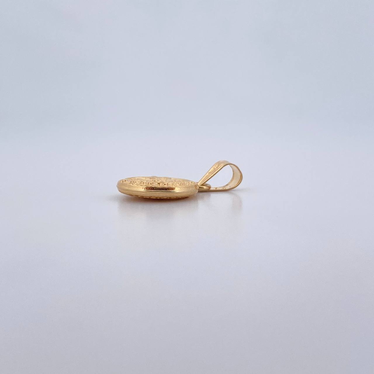 Dije Sagrada Familia 0.55gr / 3/4 in / Oro Amarillo 18K %