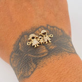 Herraje Familia 1.65gr / 2.2cm / Oro 18K &