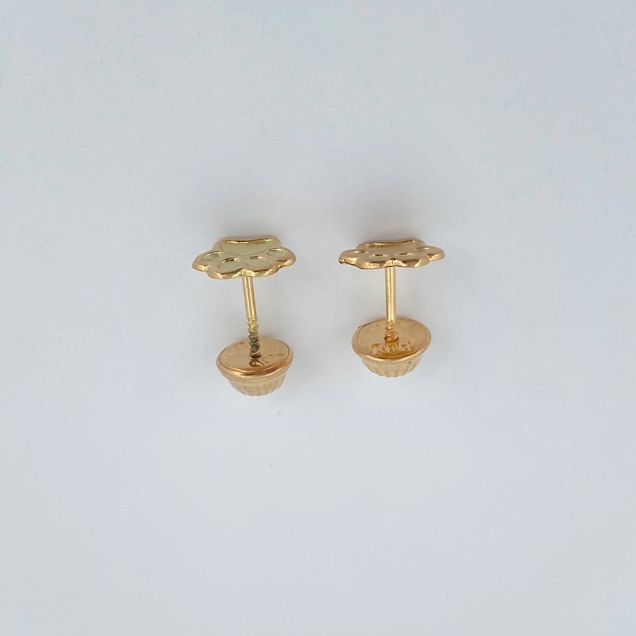 Topos Huella 0.55gr / Oro Amarillo 18K $