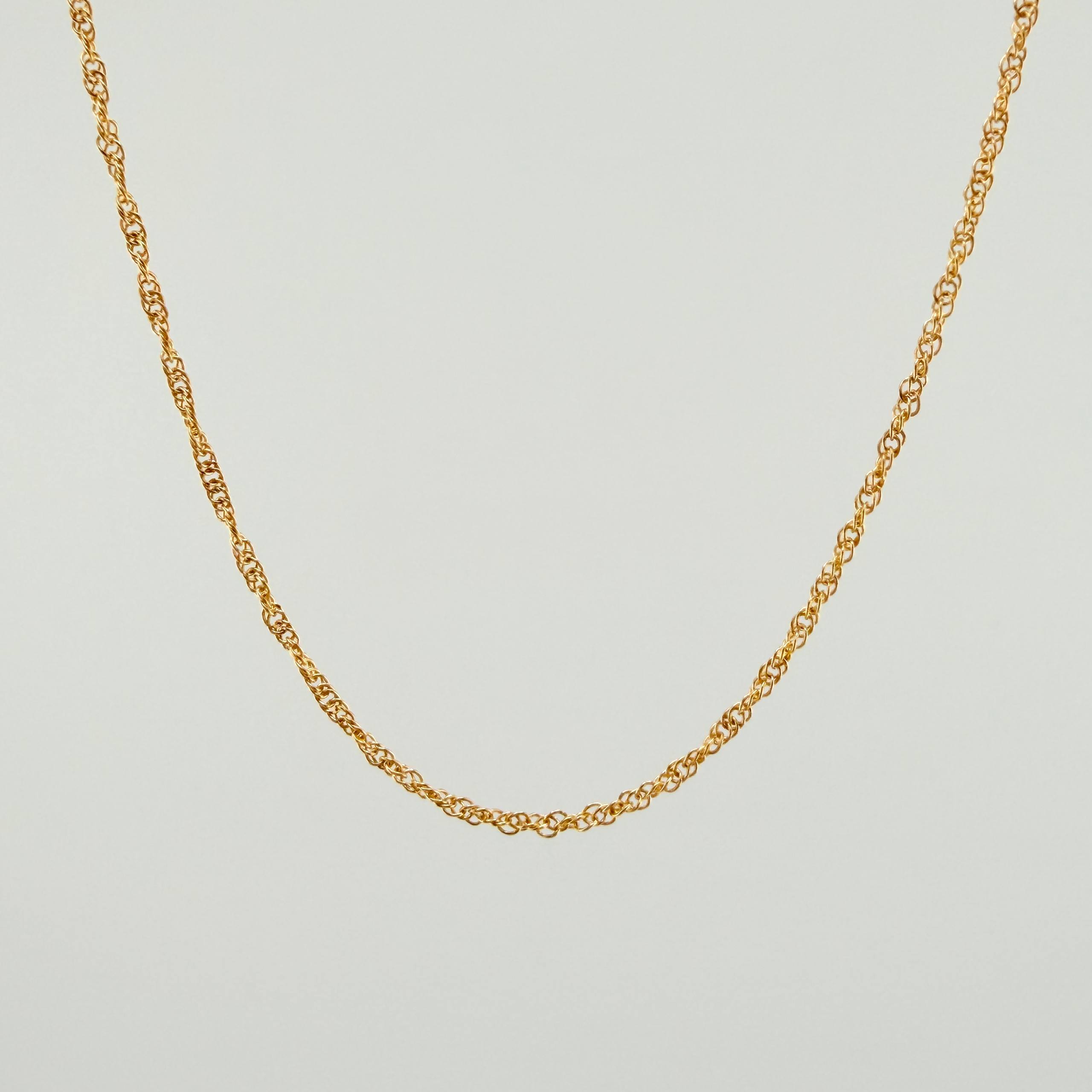 Cadena Singapur 2.9gr / 23 1/2 in / 1.4mm Oro Amarillo +3 18K