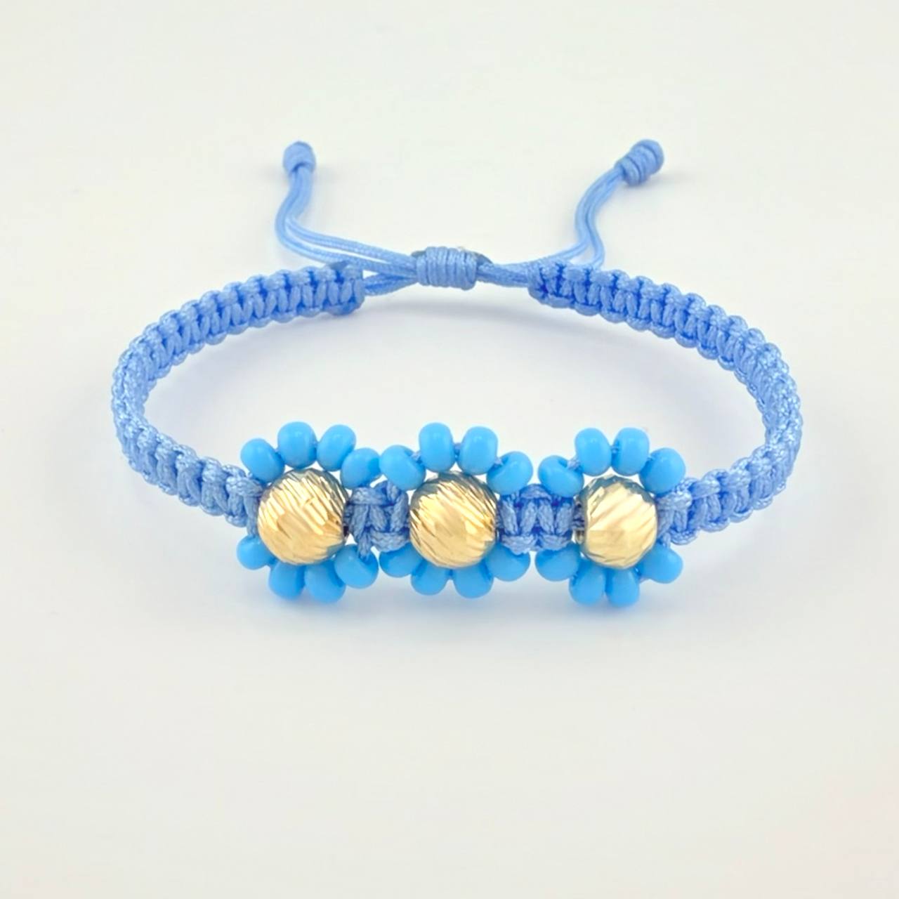 Pulsera Tejida Azul Trio Flores Oro Amarillo 18K