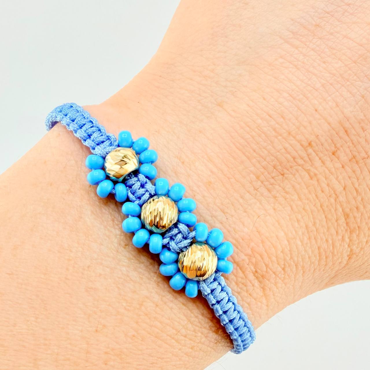Pulsera Tejida Azul Trio Flores Oro Amarillo 18K