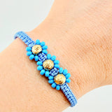 Pulsera Tejida Azul Trio Flores Oro Amarillo 18K