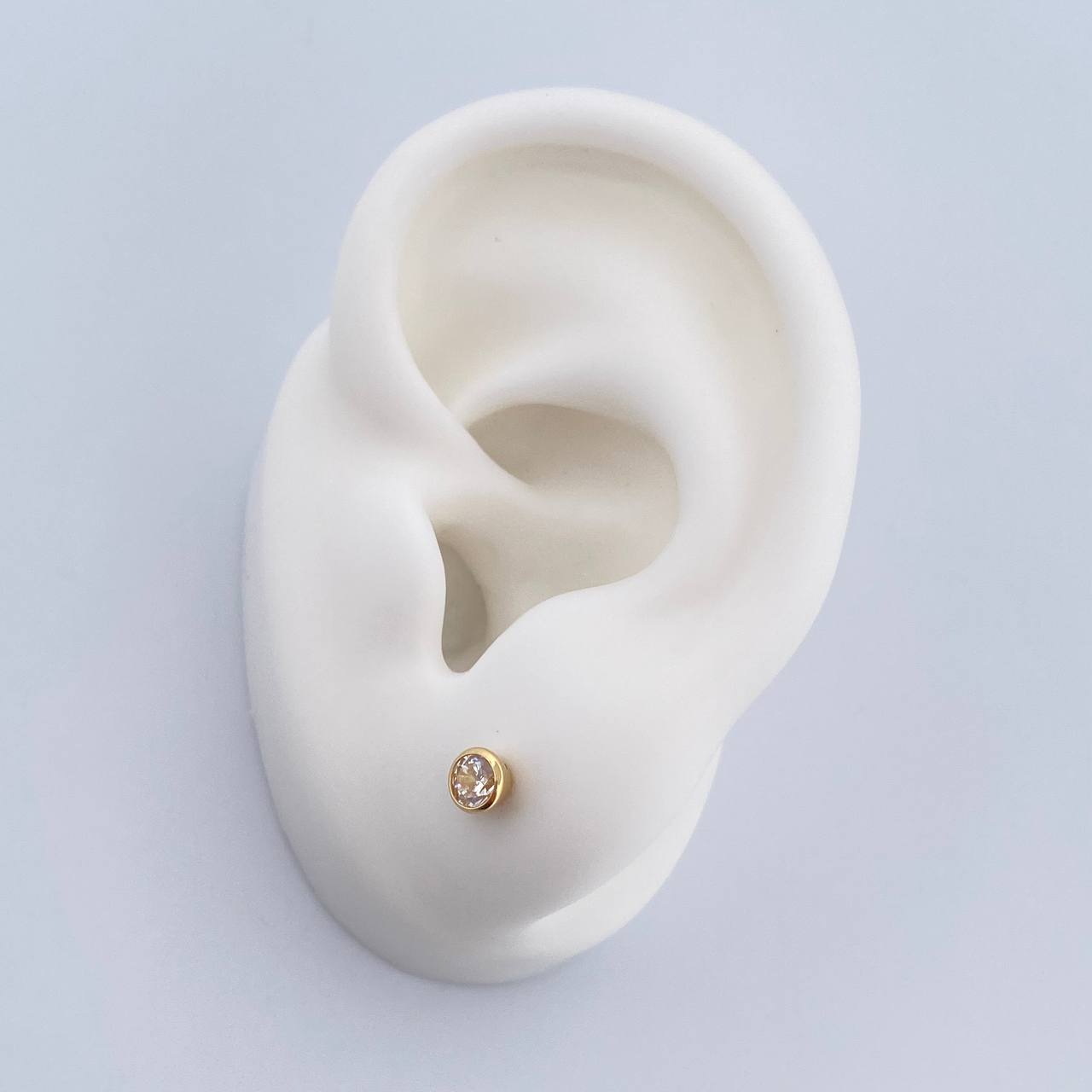 Topos Bisel 0.6gr / Circon Blanco Oro Amarillo 18K &
