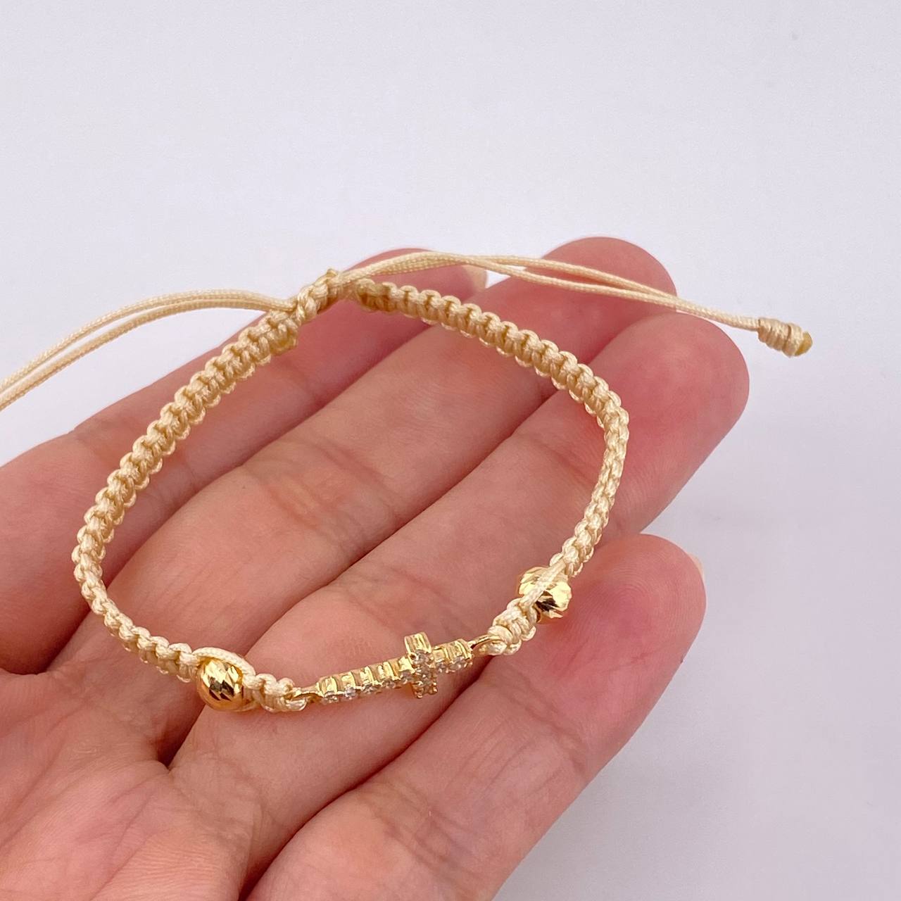 Pulsera Tejida Beige Cruz Maraquera Oro Amarillo 18K
