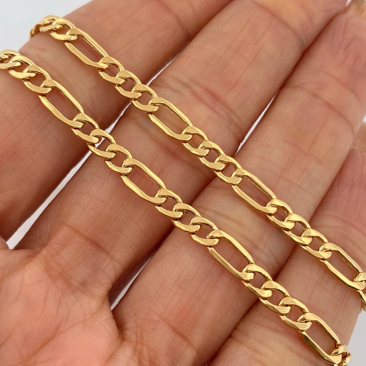 Cadena Figaro 8.85gr / 23 3/4 in / 4mm Oro Amarillo +1 18K $