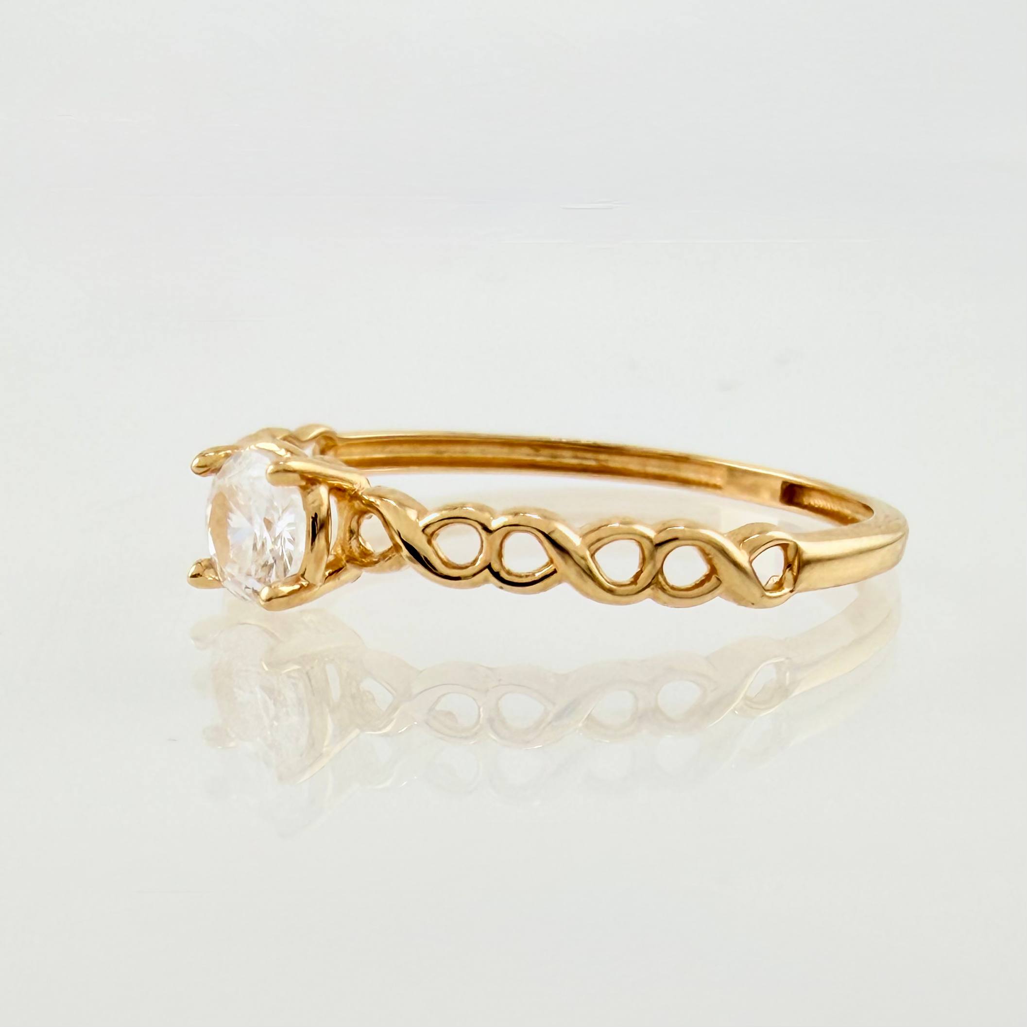 Anillo Solitario Infinitos 1.05gr / T8 / Oro Amarillo 18K