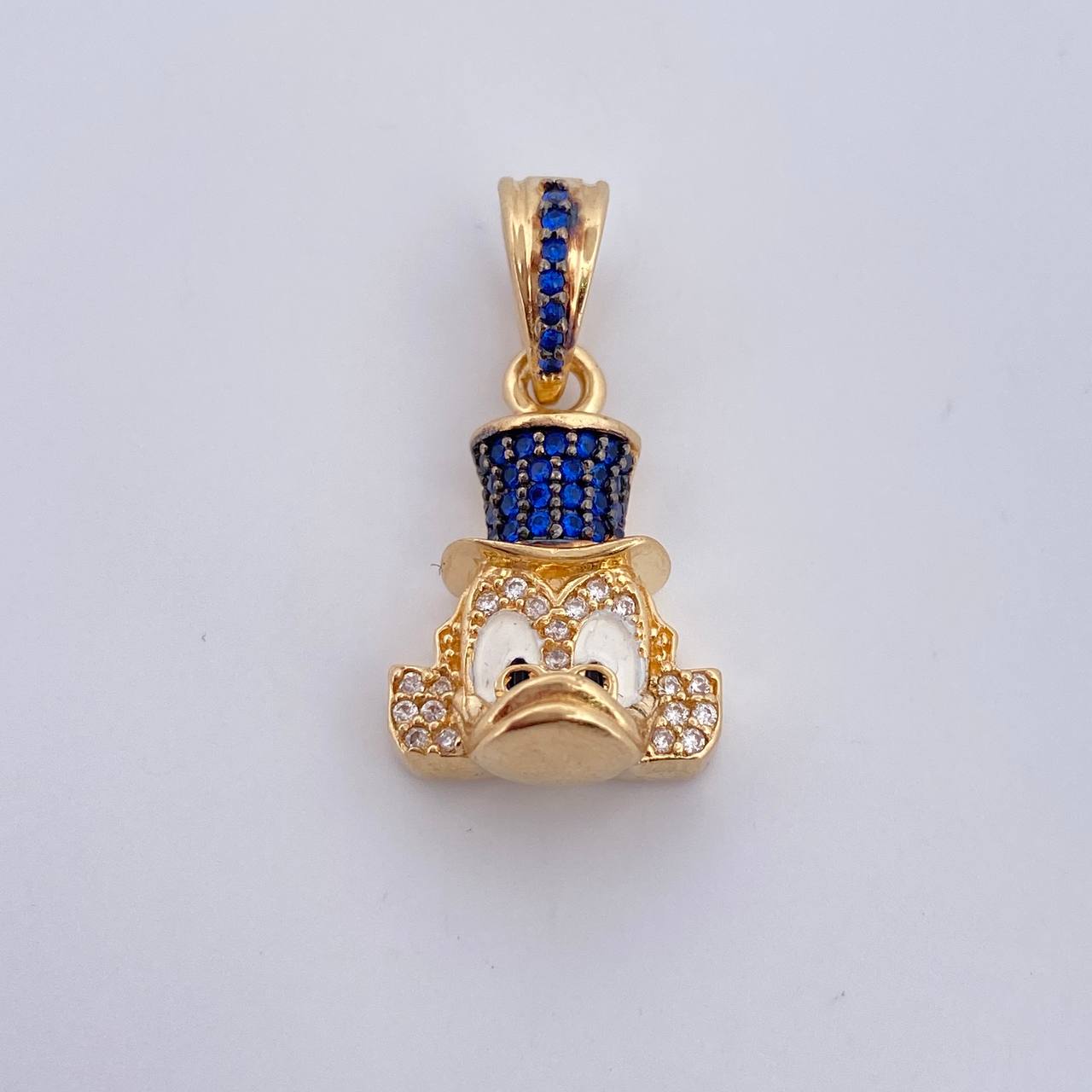 Dije Cabeza Pato 4.55gr / 2.6cm / Circones Blancos Azules Dos Oros Negro Amarillo 18K $