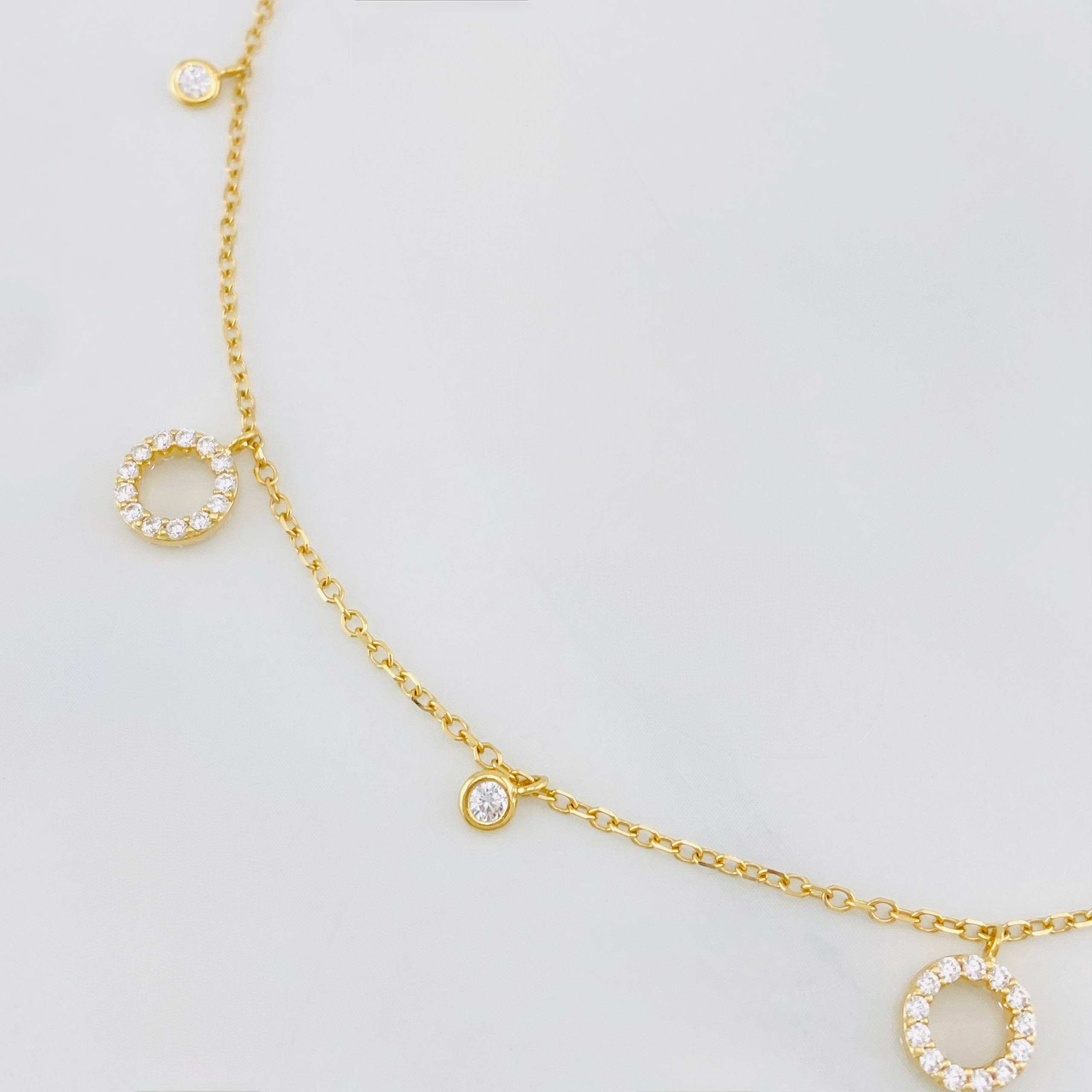 Tobillera Aro seguido círculos 3g / 9 3/4 in-9 1/4 in / 1.2mm Oro Amarillo 18K