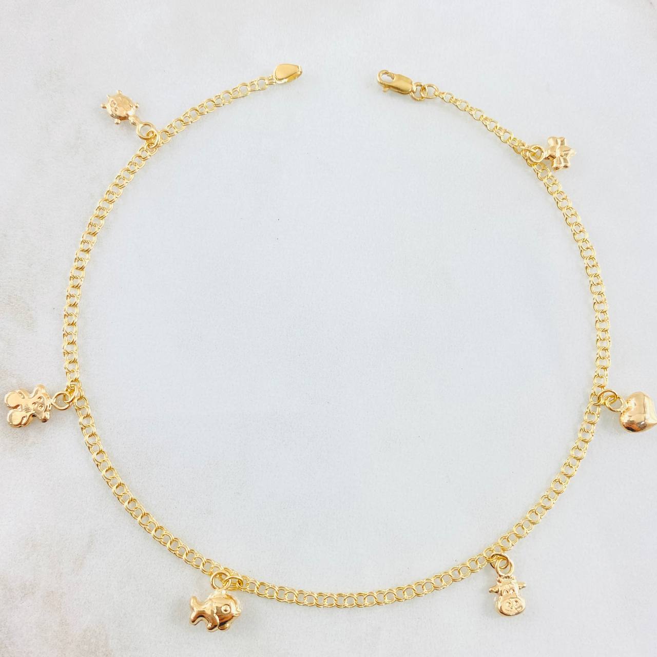 Tobillera Aro Seguido Dijes 3.7gr / 10 1/4 in / Oro Amarillo 18K *