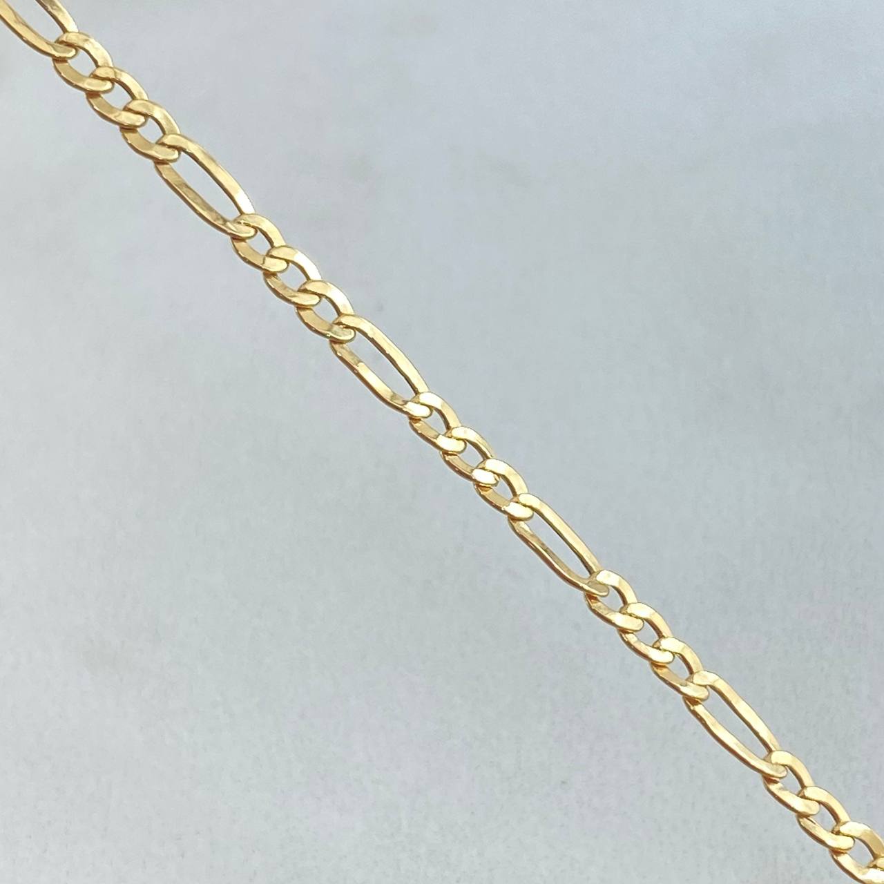 Figaro Bracelet 1.4gr / 7.7in / +1 18K Gold ©