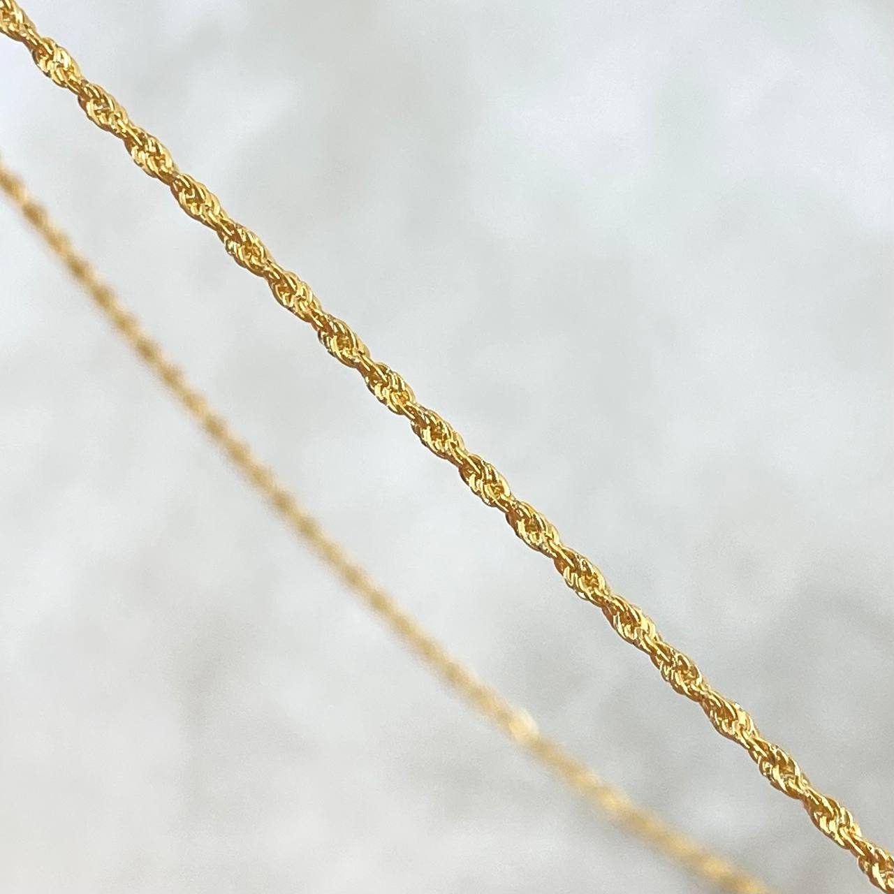 Set Cadena Lazo 0.95gr / 50cm / 1.2mm + Dije Cruz 0.25gr / 1.5cm Lisa 1.2gr Oro Amarillo 18K (Oferta)