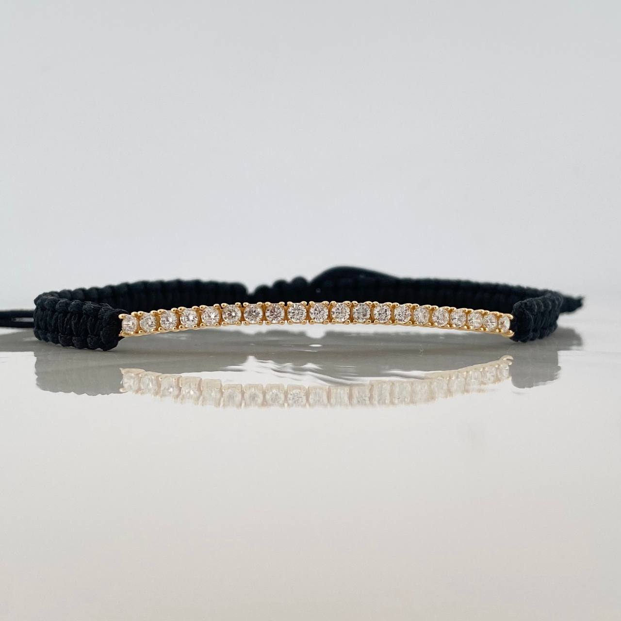 Pulsera Tejida Negra Tennis Oro Amarillo 18K