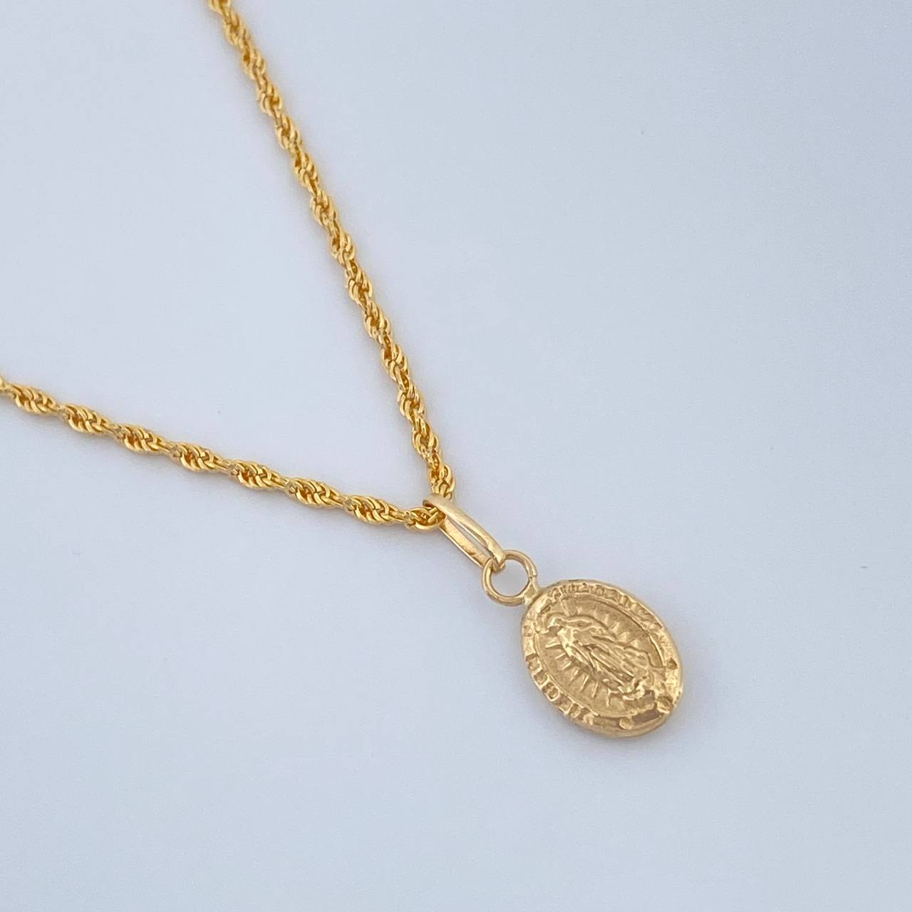 Set Cadena y Dije Lazo + Virgen Guadalupe 1.35gr / 19 3/4 in / Oro Amarillo 18K $