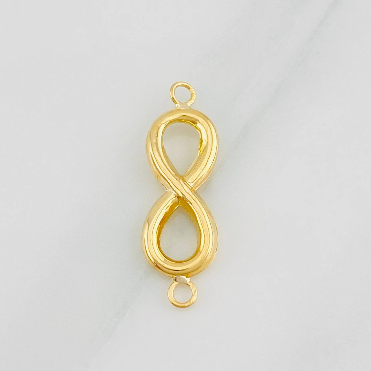Herraje Infinito 0.6g / 1 in Oro Amarillo 18K