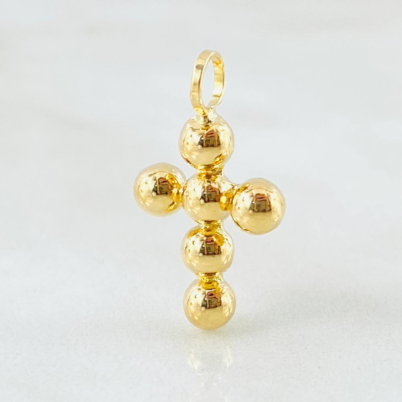 Dije Cruz Esferas Consecutivas 0.75gr / 3/4 in / Oro Amarillo 18K *