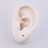 Ruby Stud Earrings 6pts 0.65gr / 2.4mm 18K Yellow Gold *