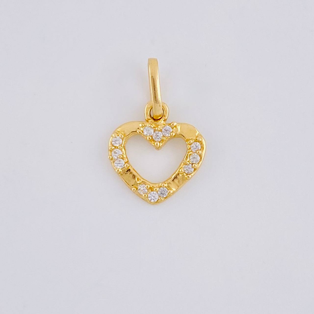 Dije Silueta Corazon Tupido 0.65g / 1/2 in Oro Amarillo 18K