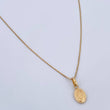 Set Cadena Veneciana 1.35gr/50.1cm/0.6mm + Dije Virgen Milagrosa 0.35gr/1.4cm Troquelado Oro Amarillo 18K (Oferta) $