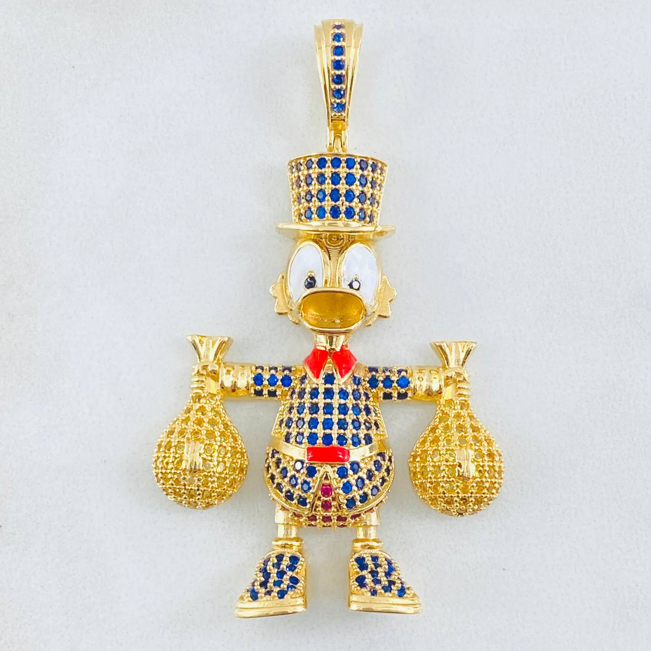 Dije Pato Bolsas Dinero 13.15gr / 2 1/4 in / Oro Amarillo 18K ©