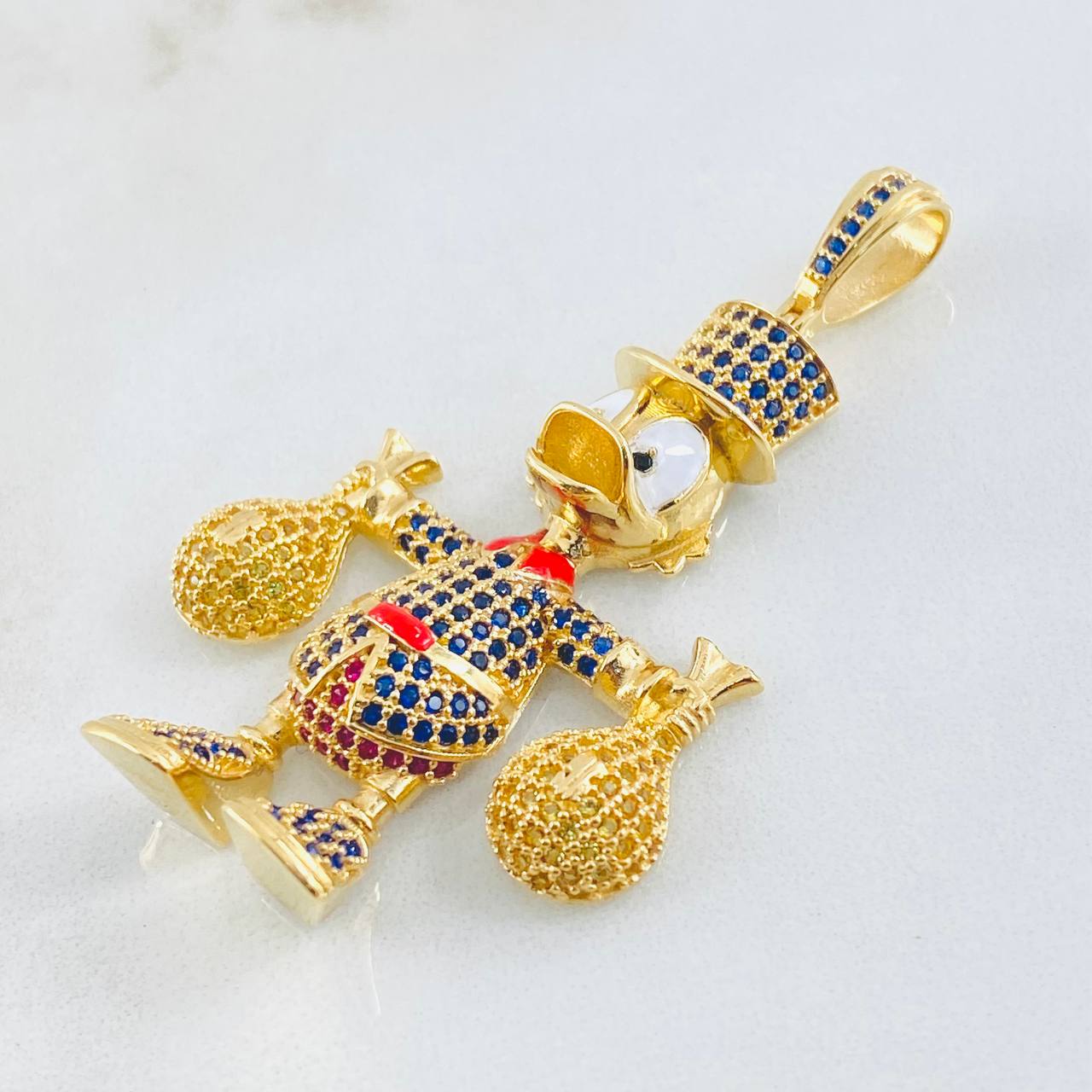 Dije Pato Bolsas Dinero 13.15gr / 2 1/4 in / Oro Amarillo 18K ©