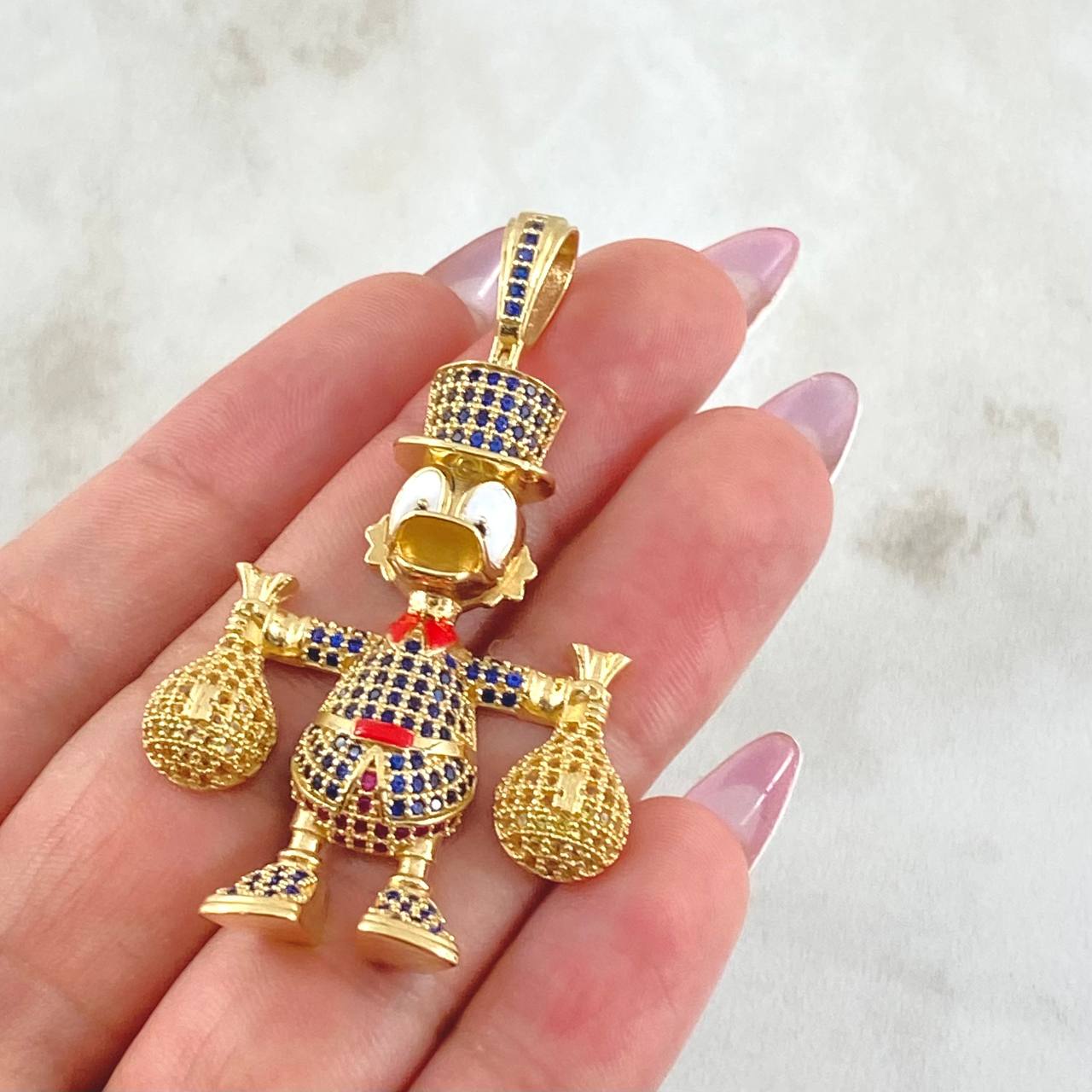 Dije Pato Bolsas Dinero 13.15gr / 2 1/4 in / Oro Amarillo 18K ©