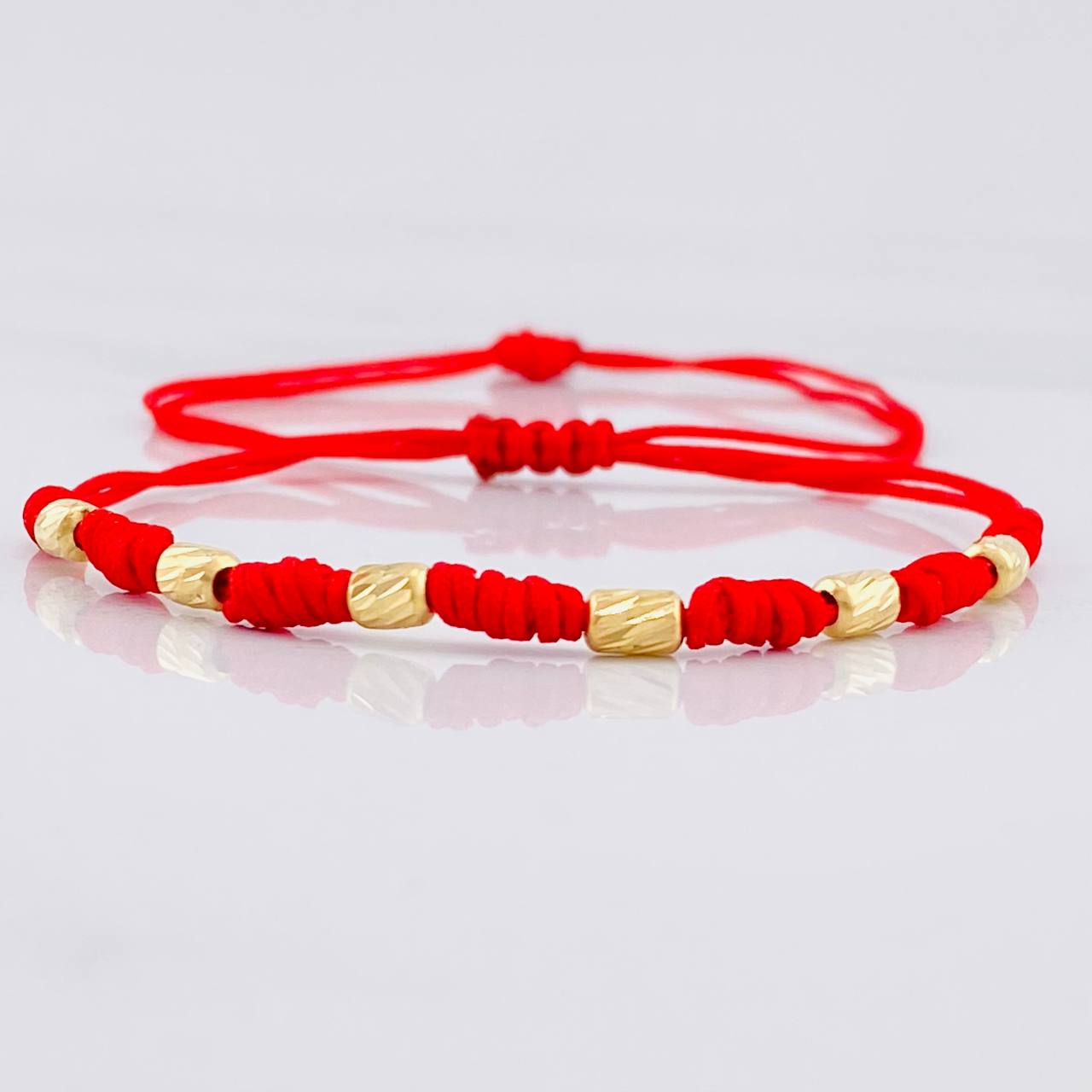 Red Woven Bracelet Seven Knots Yellow Gold 18K