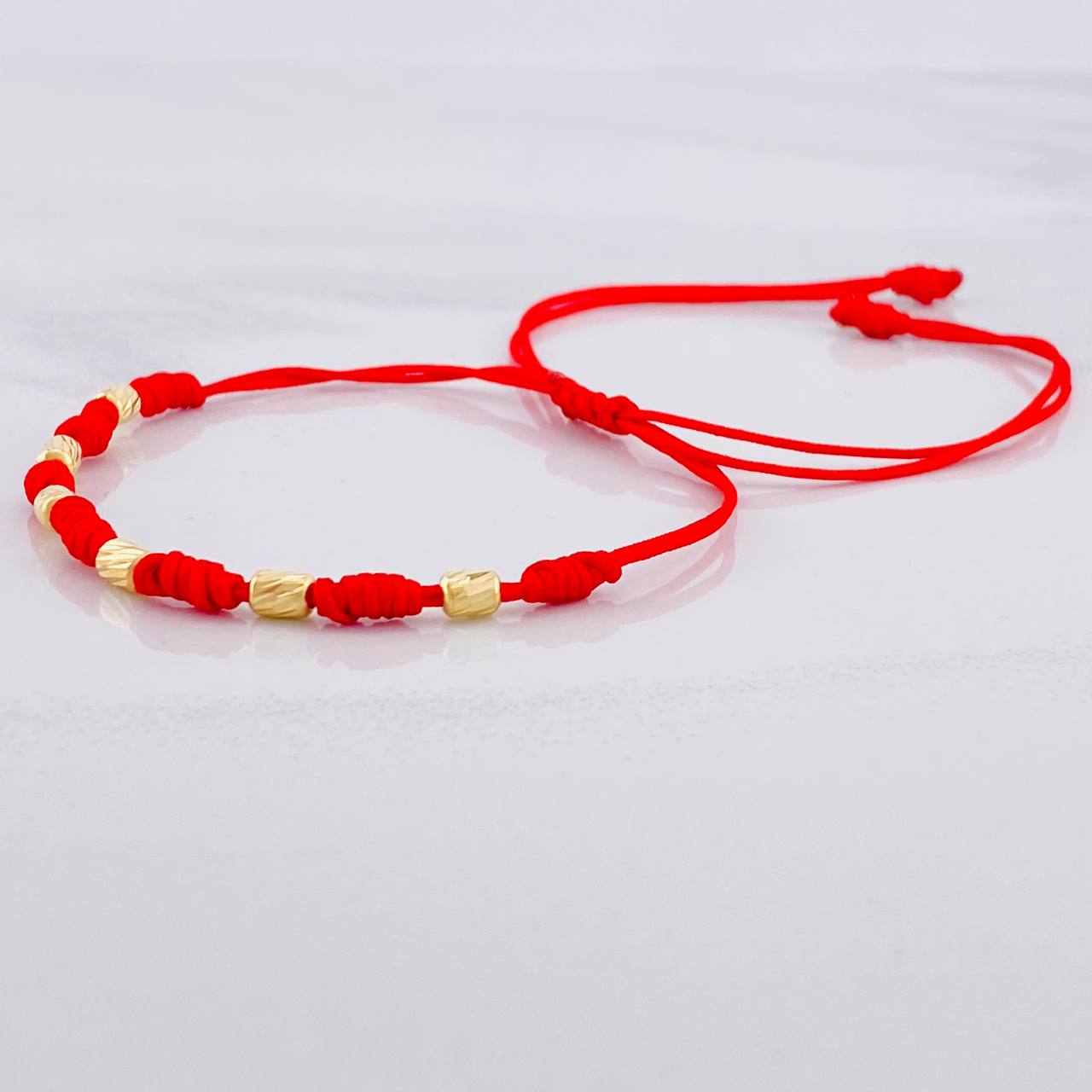 Red Woven Bracelet Seven Knots Yellow Gold 18K