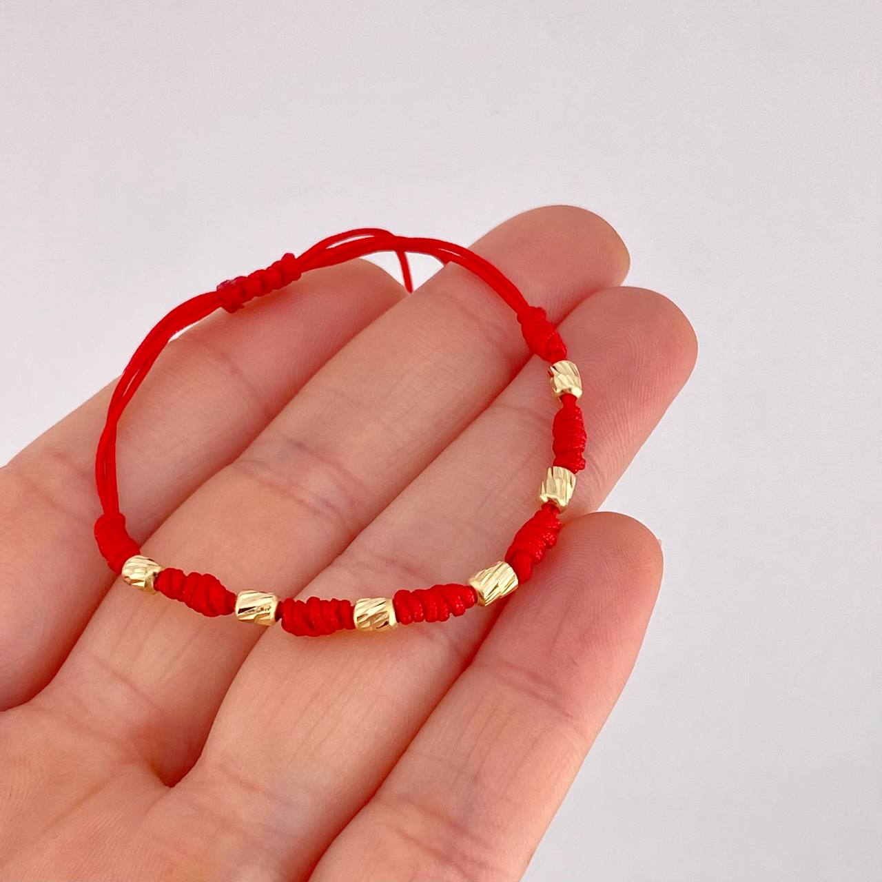 Red Woven Bracelet Seven Knots Yellow Gold 18K