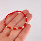 Red Woven Bracelet Seven Knots Yellow Gold 18K