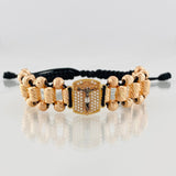 Black Woven Bracelet with Miraculous Christ of Buga Cross in Three 18K Golds