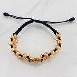 Black Woven Bracelet with Miraculous Christ of Buga Cross in Three 18K Golds