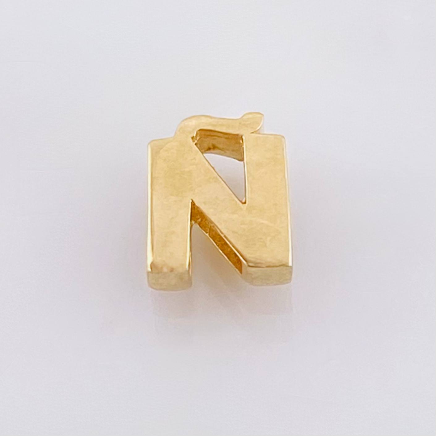 Herraje Tambor Letra Ñ 0.5gr / 7mm Oro Amarillo 18K